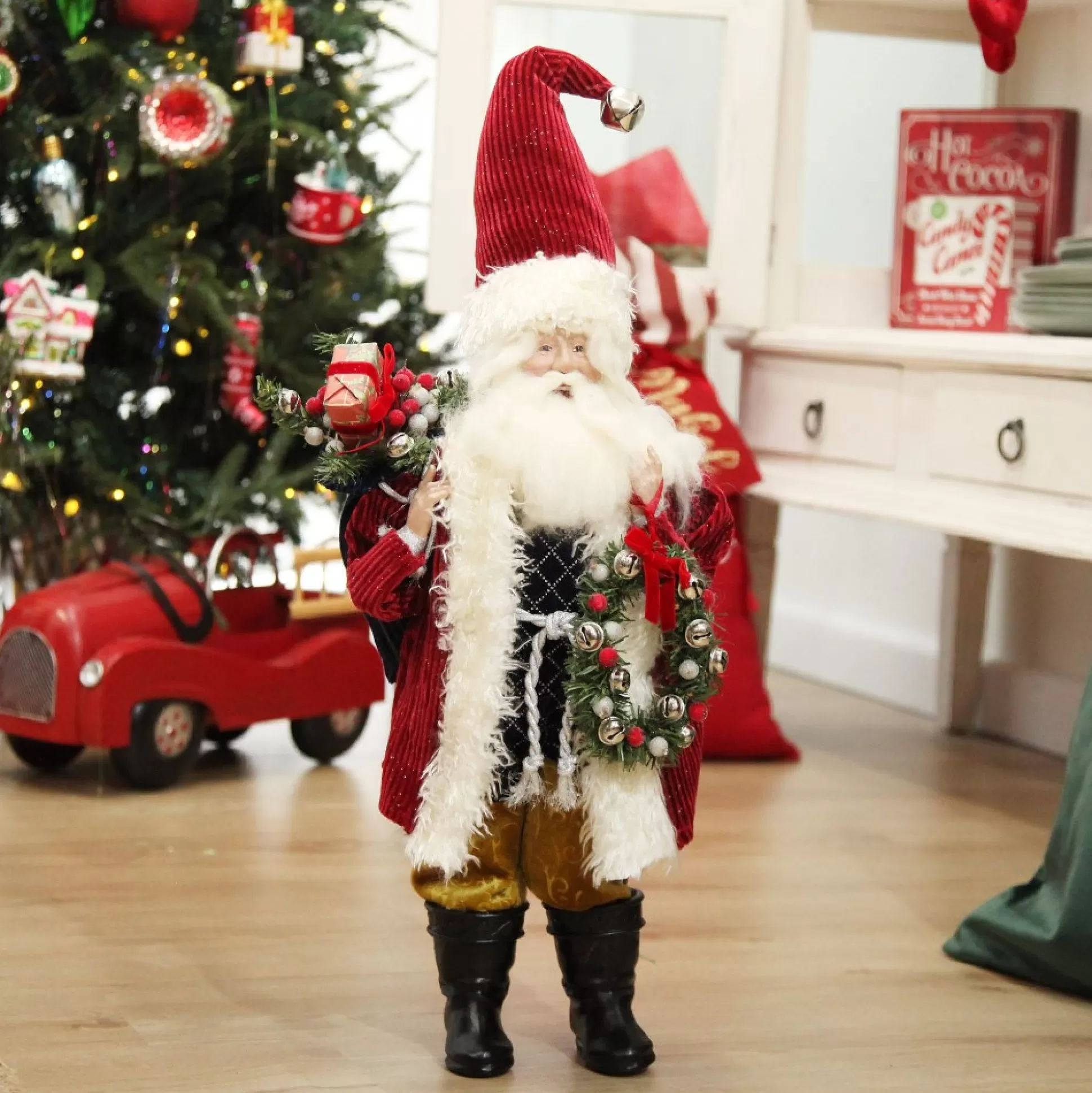 Traditional Santa holding Wreath Christmas Figurine Christmas Figurines |